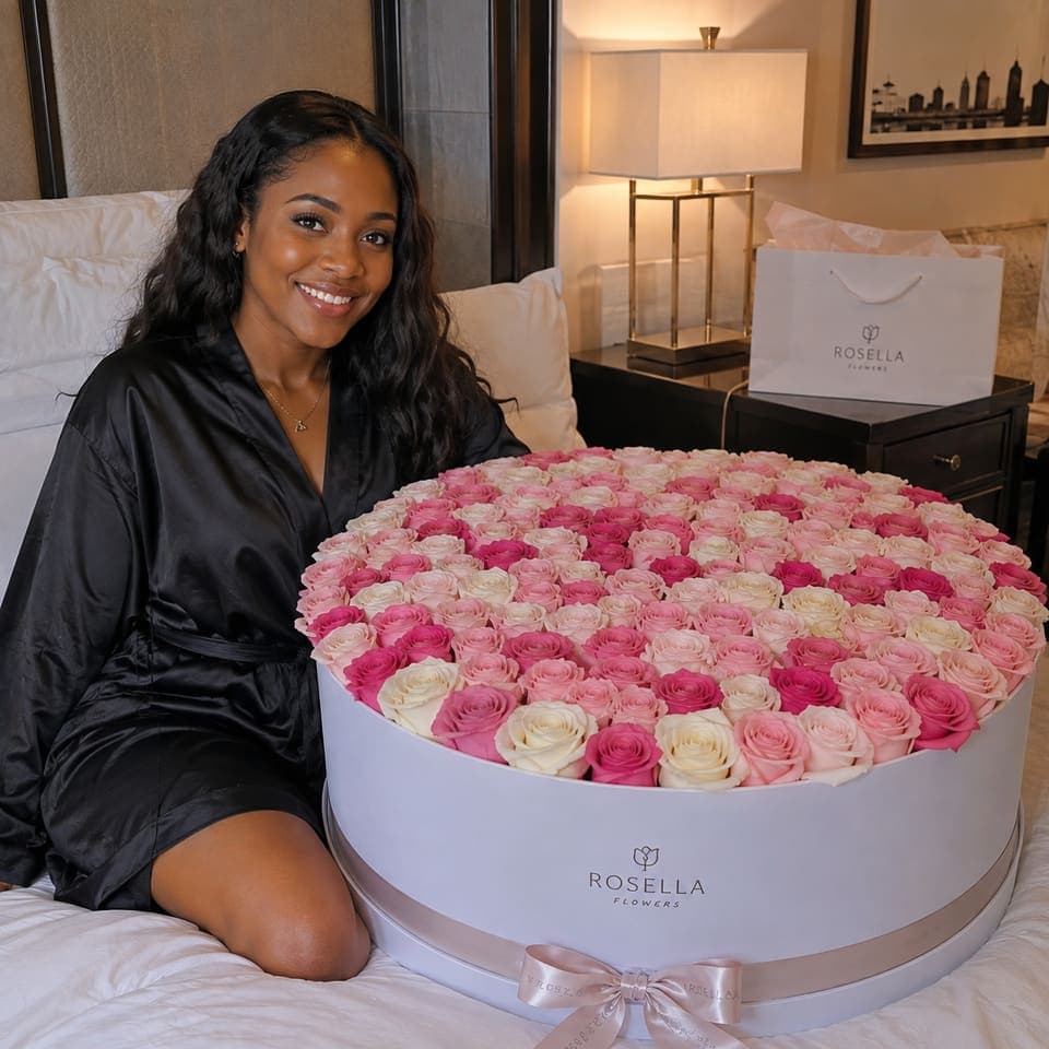 A customer seated at home with an oversized round rose arrangement
