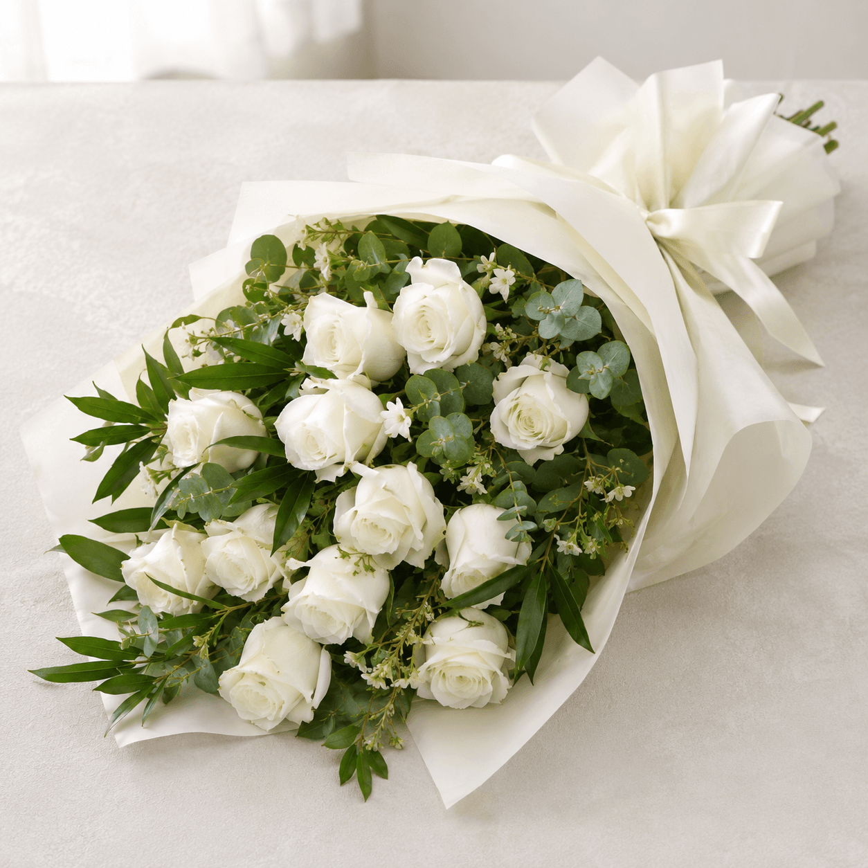 White Rose Sheaf white rose funeral sheaf with white roses by Rosella Flowers & Gifting in Polokwane